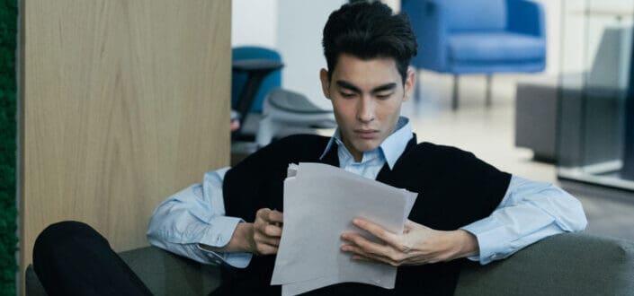 Male professional looking at documents